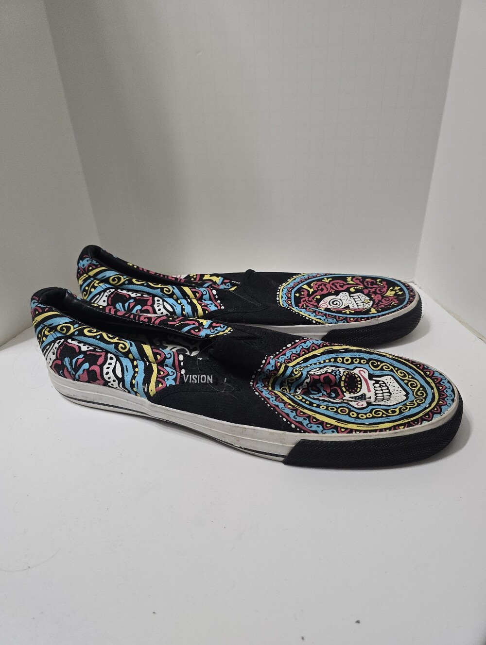 Vision Street Wear slip-on skate shoes featuring a colorful Day of the Dead S